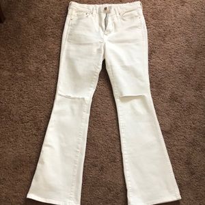 White Flare jeans with ripped accent